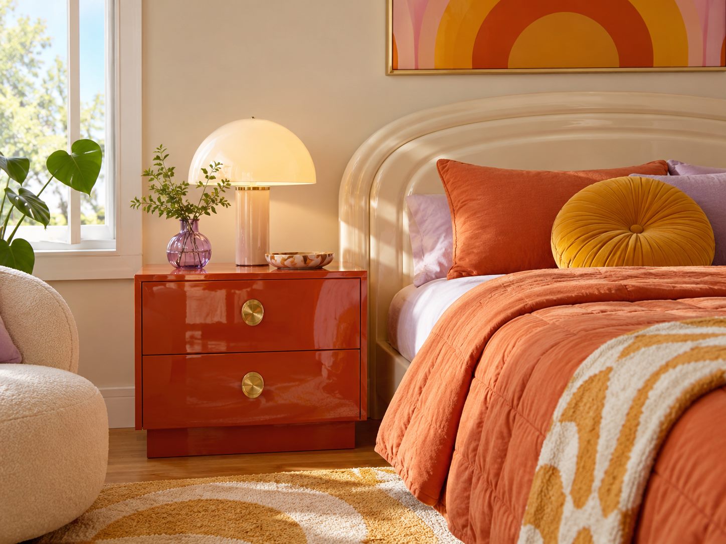 Glossy red bedside cabinet beside a bed