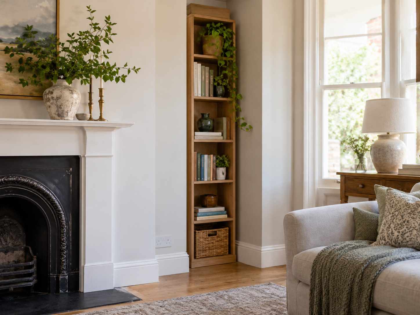 Narrow bookcase fitted into a small alcove